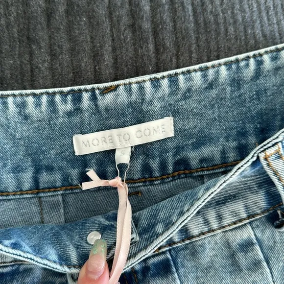 Nika Pleated Mini Skirt in Light Wash size smallMORE TO COME